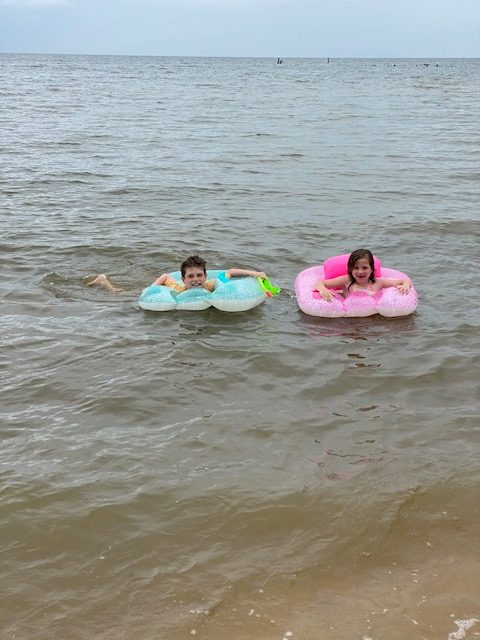 A picture containing snow, pink, wearing, skiing
Description automatically generated